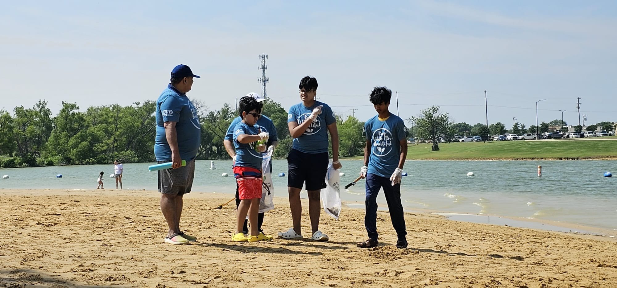 Mayor of Little Elm Mr. Curtis J. Cornelious and  volunteers joined in the Beach Clean Up at Little Elm Beach, Texas on May 20,2023